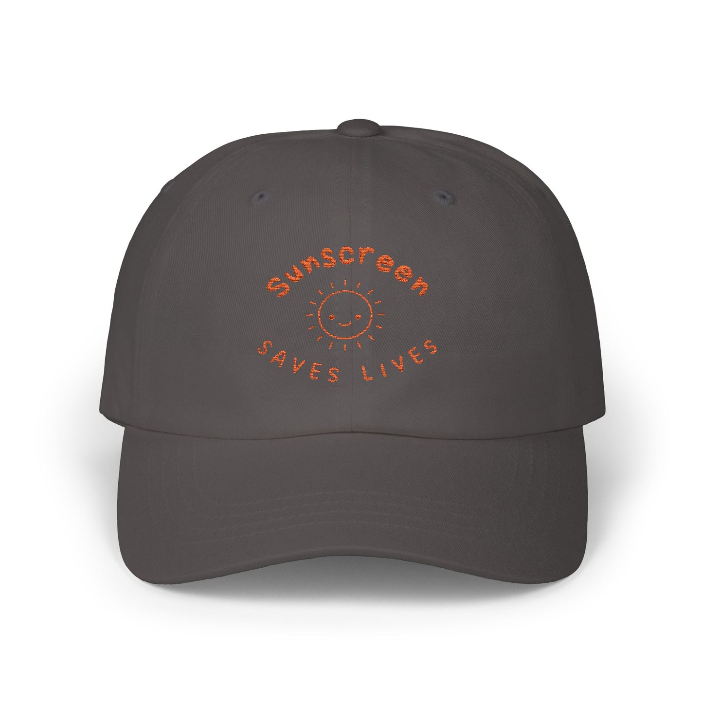 Bold Sunscreen Saves Lives slogan baseball cap, with smiley sun graphic, for anti-aging fashion, SPF awareness, safe sun, sunscreen, skin protection, sun protection statement hat